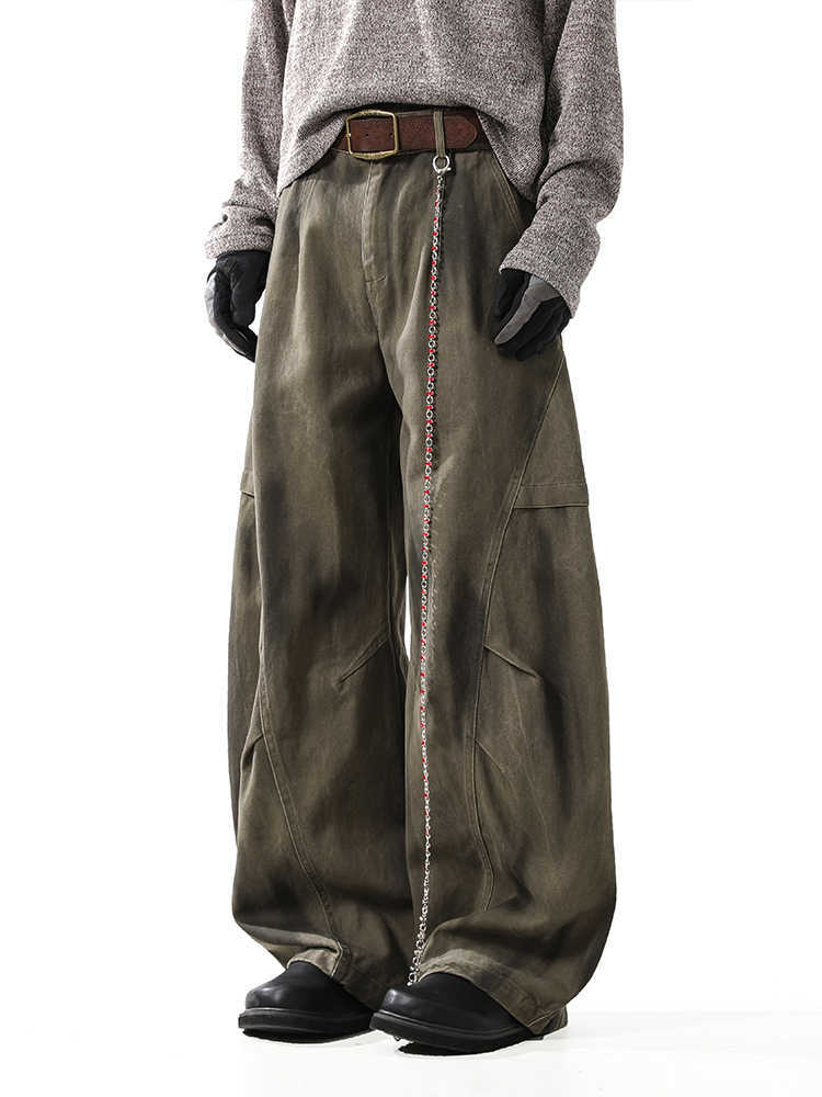 Washed and distressed curved-leg denim pants