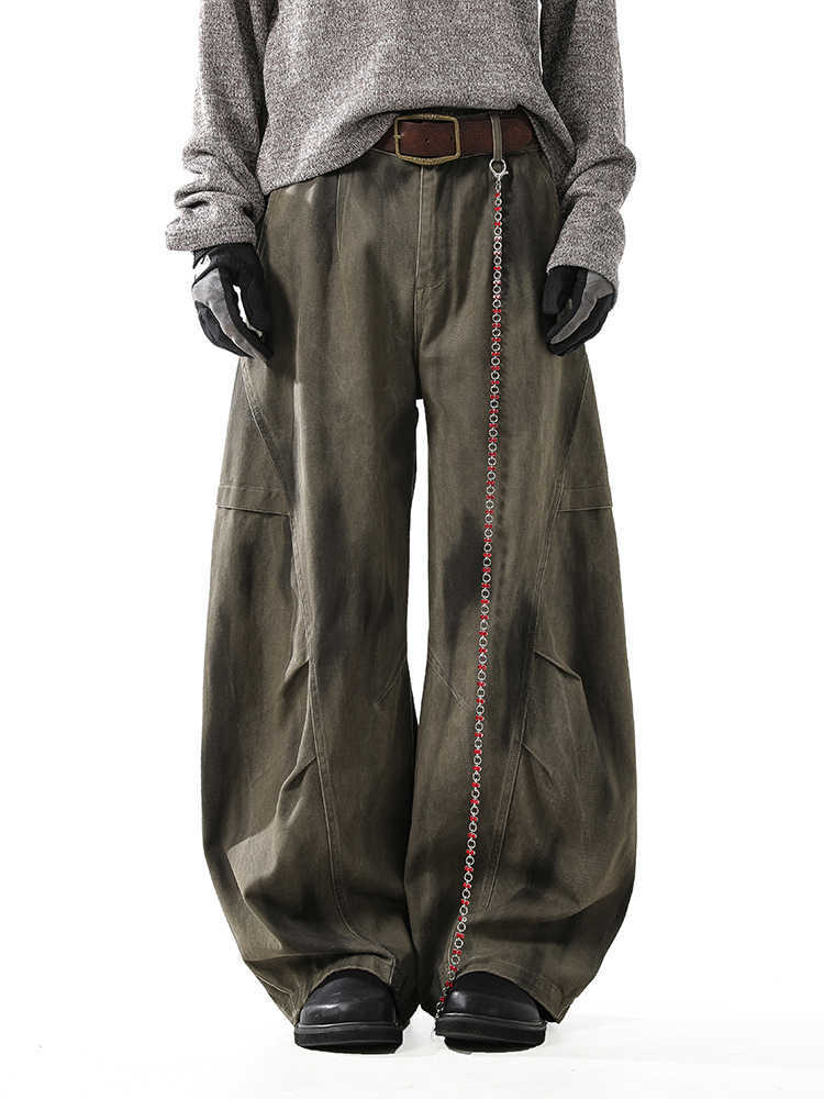 Washed and distressed curved-leg denim pants