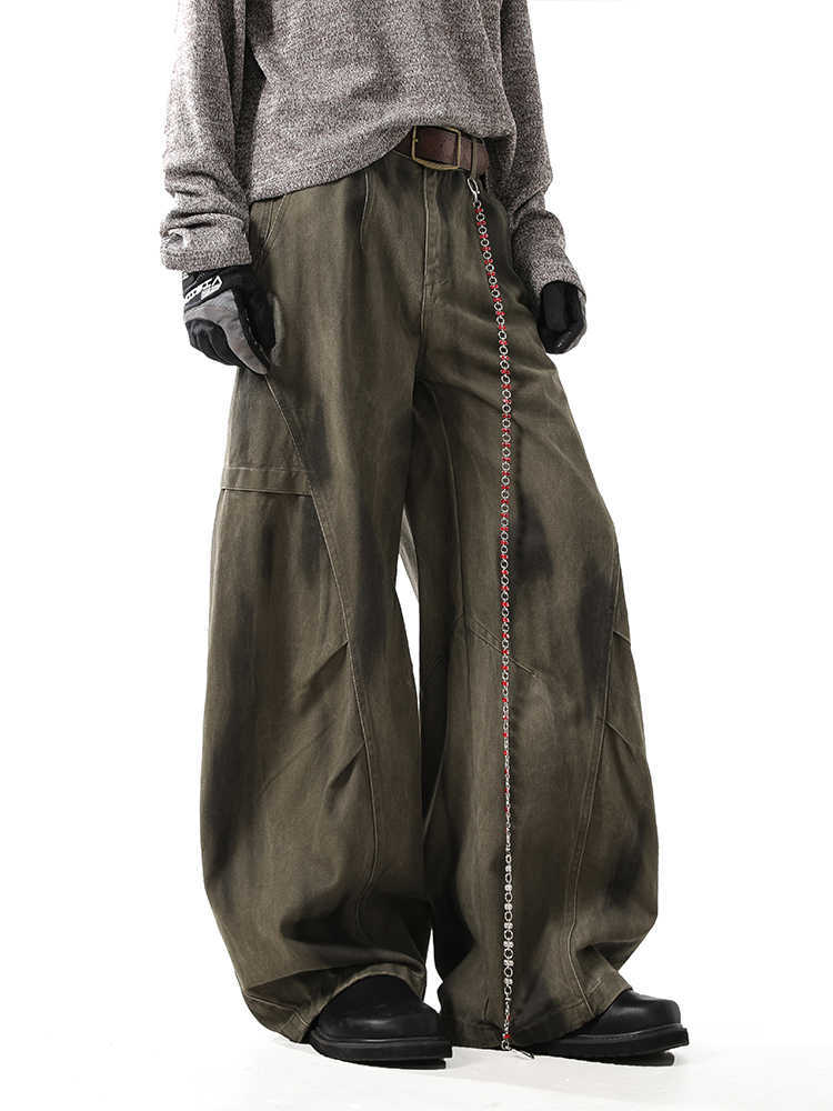 Washed and distressed curved-leg denim pants